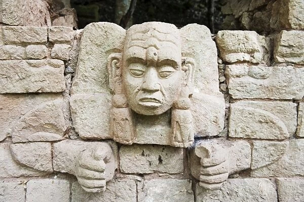 Sculpted head stone at Mayan archeological site, Copan Ruins, UNESCO World Heritage Site