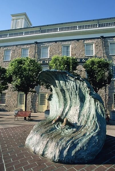 Sculpture depicting someone diving into a wave