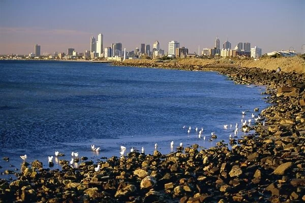 Seafront in the suburb of Saint Kilda looking towards the Melbourne city skyline