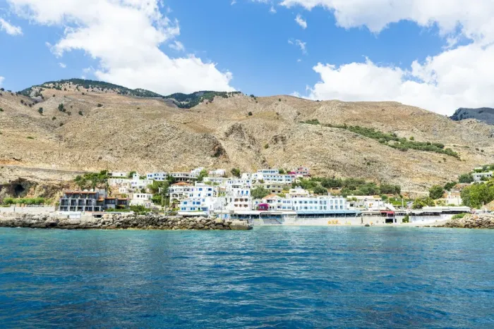 Framed Print : Seaside town resort of Hora Sfakion view from boat trip in the blue sea, Crete island, Greek Islands, Greece, Europe Framed Print : Seaside town resort of Hora Sfakion view from boat trip in the blue sea, Crete island, Greek Islands, Greece, Europe
