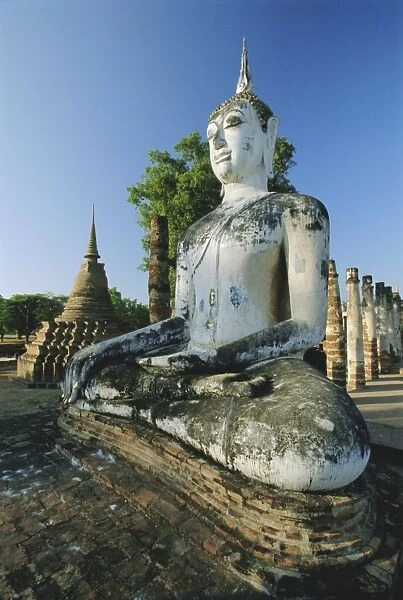 Seated Buddha and ruined Chedi