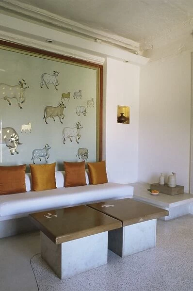 Seating area in bedroom suite with images of sacred cows