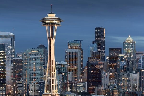 Seattle city skyline at night with illuminated office buildings and Space Needle
