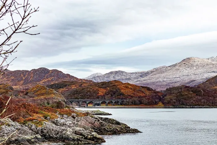 Framed Print : Serene landscape with a tranquil lake, autumnal trees, and distant snow-capped mountains under a cloudy sky in Scotland, United Kingdom, Europe Framed Print : Serene landscape with a tranquil lake, autumnal trees, and distant snow-capped mountains under a cloudy sky in Scotland, United Kingdom, Europe
