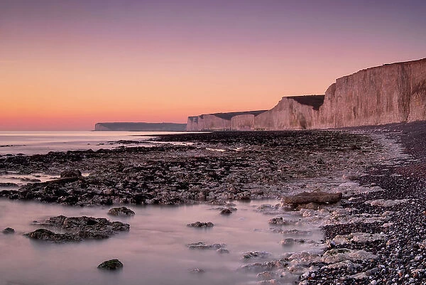 The Seven Sisters white chalk cliffs at sunset, Birling Gap, South Downs National Park, East Sussex, England, United Kingdom, Europe