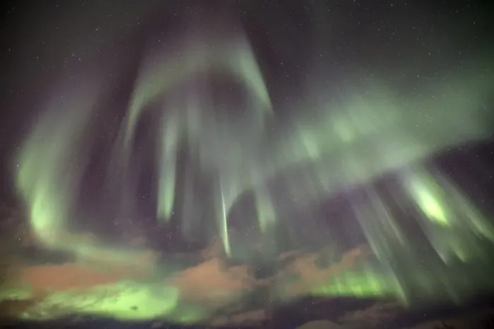 Framed Print : The shapes of green light of the Aurora Borealis color the sky, Lyngen Alps, Troms