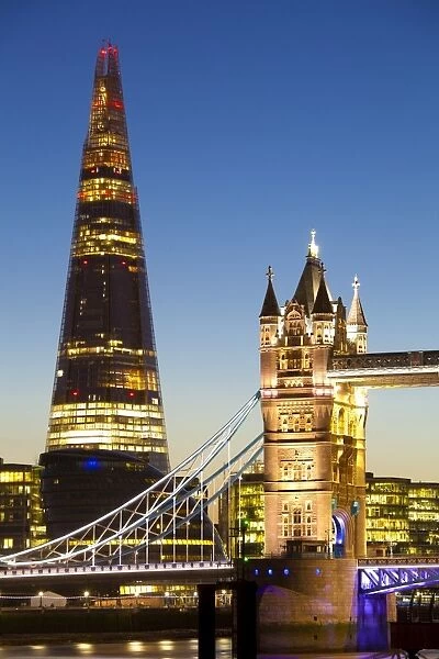 The Shard building and Tower Bridge at Night, London, United Kingdom. The Shard is the tallest building in Europe (2012)