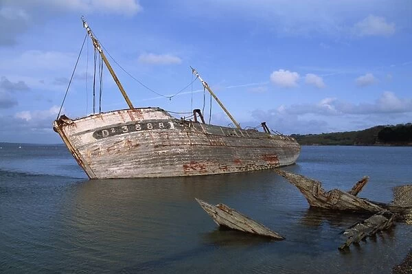Ship wreck in Le Fret harbour in Brittany, France, Europe