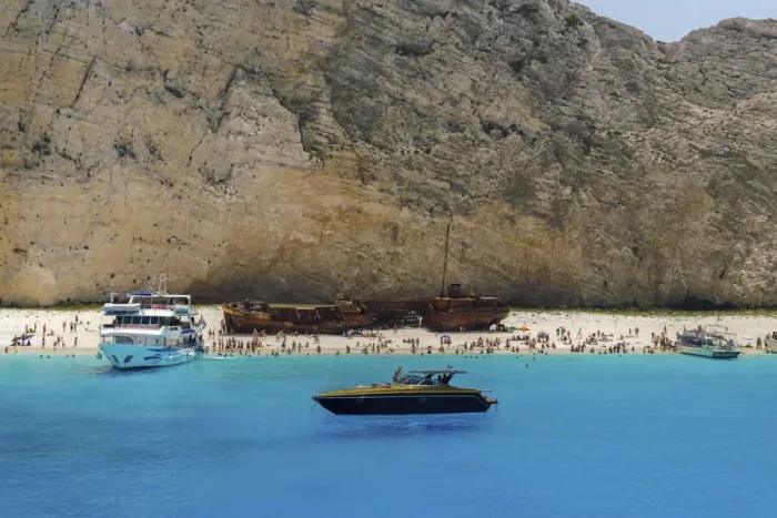 Framed Print : Shipwreck on Navagio Beach, a famous beach with crystal clear waters, moored leisure boats and bathers, Zakynthos, Ionian Islands, Greek Islands, Greece, Europe Framed Print : Shipwreck on Navagio Beach, a famous beach with crystal clear waters, moored leisure boats and bathers, Zakynthos, Ionian Islands, Greek Islands, Greece, Europe