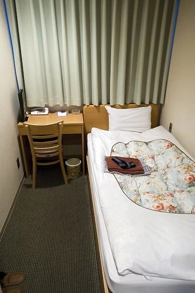 A shoebox-sized hotel room less than two metres wide and costing 8, 000 Yen ($80