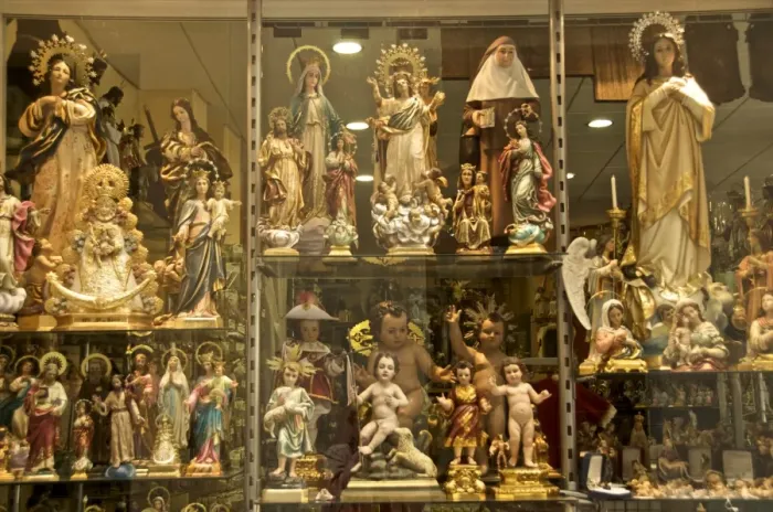 Framed Print : Shop window of a religious articles shop with virgins, angels, and Christ for sale Framed Print : Shop window of a religious articles shop with virgins, angels, and Christ for sale