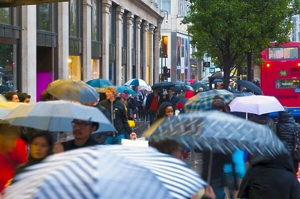 Shoppers in the rain, Oxford Street, London, England, United Kingdom, Europe