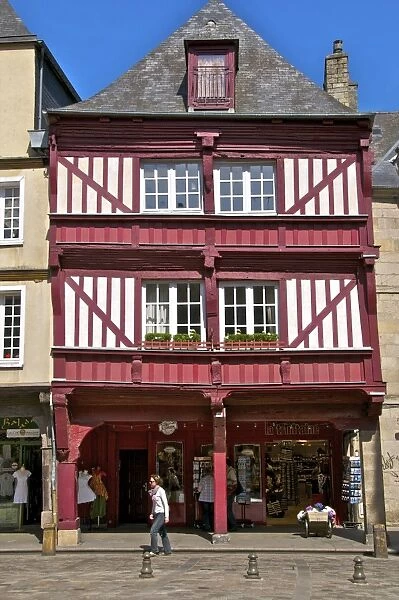 Shops and red half timbered house, Cordeliers Square, Dinan, Brittany, France, Europe
