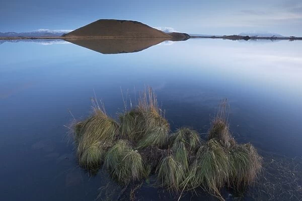 Shores of Lake Myvatn at dusk, fine pseudo-crater in the distance, near Skutustadir