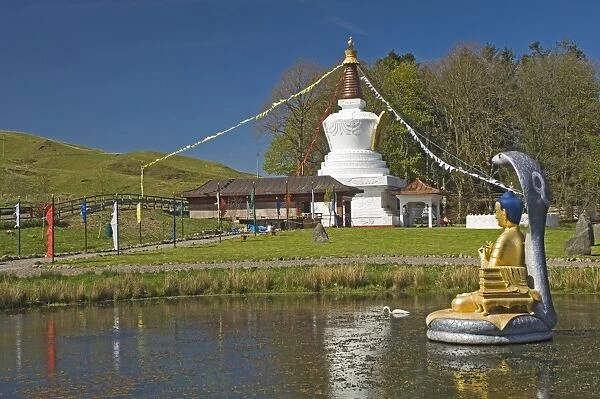 The Shrine Pond with cobra canopy prayer flags and stupa