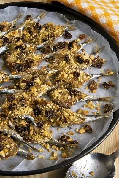Sicilian style anchovies, with crushed almonds, raisin, grated bread, seeds of wild fennel