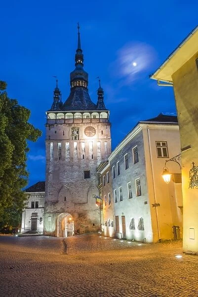 Sighisoara Clock Tower at night in the historic centre of Sighisoara, a 12th century Saxon town