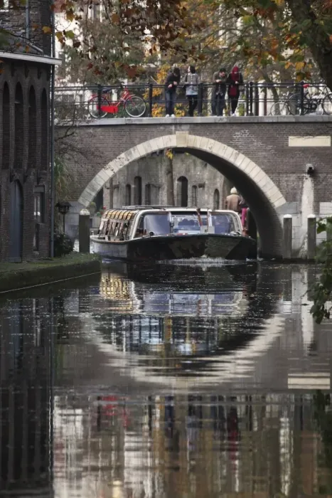 Framed Print : A sightseeing barge under a bridge on the Oudegracht Canal in the Dutch city of Utrecht Framed Print : A sightseeing barge under a bridge on the Oudegracht Canal in the Dutch city of Utrecht