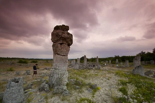 Sightseers at the rock formations known as the Stone Forest, 50 million year old tree-like stone columns, Varna
