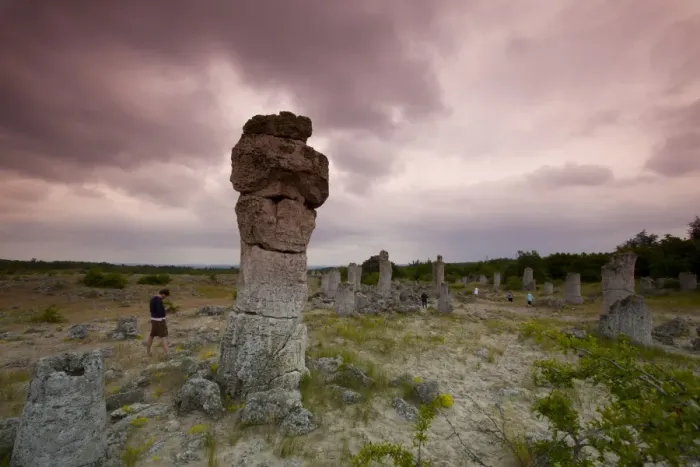 Framed Print : Sightseers at the rock formations known as the Stone Forest, 50 million year old tree-like stone columns, Varna Framed Print : Sightseers at the rock formations known as the Stone Forest, 50 million year old tree-like stone columns, Varna