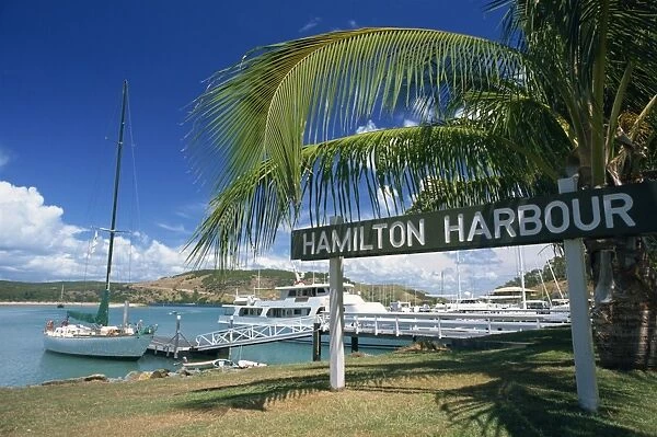 The sign and boats at Hamilton Harbour on Hamilton Island, Great Barrier Reef
