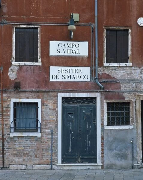 Signs on a house in Venice