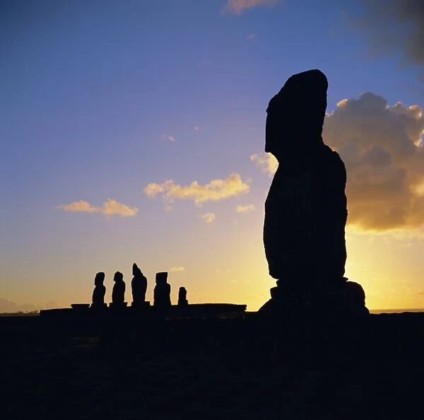 Silhouette of Ahu Tahai in foreground and behind the five moai (statues) of Ahu Vai Uri
