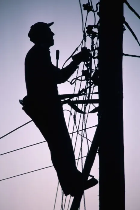 Framed Print : Silhouette of engineer working up a telegraph pole, East Sussex, England Framed Print : Silhouette of engineer working up a telegraph pole, East Sussex, England