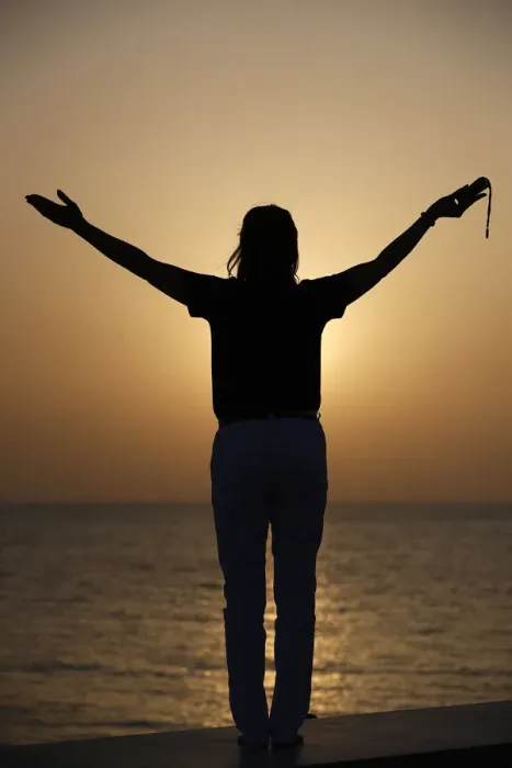 Framed Print : Silhouette of faithful woman praying with rosary beads at sunset as concept for religion Framed Print : Silhouette of faithful woman praying with rosary beads at sunset as concept for religion