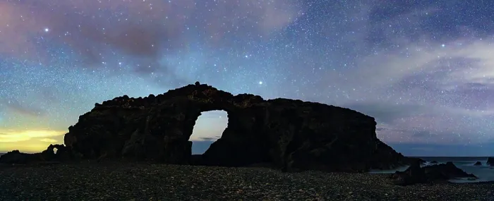 Framed Print : Silhouette of majestic natural stone arch Arco del Jurado under a starry night sky, Fuerteventura, Canary Islands, Spain Framed Print : Silhouette of majestic natural stone arch Arco del Jurado under a starry night sky, Fuerteventura, Canary Islands, Spain