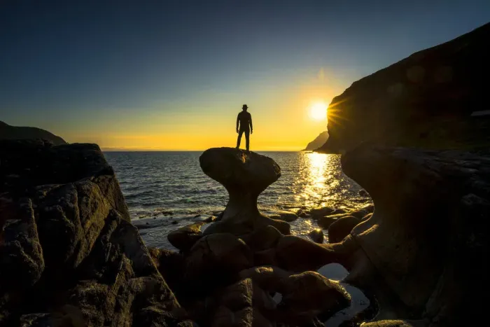 Framed Print : Silhouette of man admiring sunset standing on top of Kannesteinen rock, Oppedal, Vagsoy Framed Print : Silhouette of man admiring sunset standing on top of Kannesteinen rock, Oppedal, Vagsoy