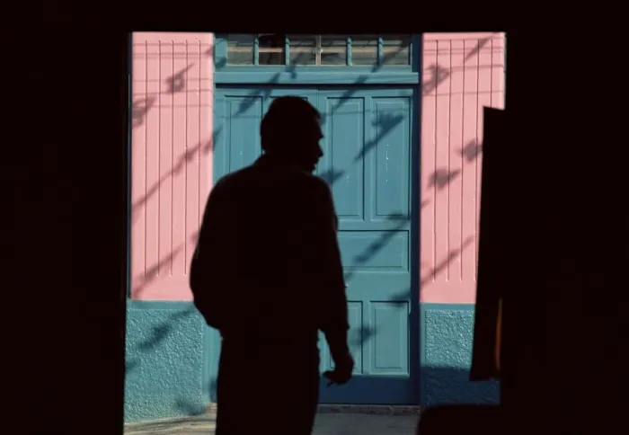 Framed Print : Silhouette of a man leaving a restaurant, El Cobre, Chile, South America Framed Print : Silhouette of a man leaving a restaurant, El Cobre, Chile, South America