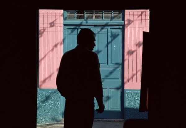 Silhouette of a man leaving a restaurant, El Cobre, Chile, South America