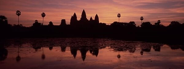 Silhouette and reflections of the temple of Angkor Wat at sunrise, UNESCO World Heritage Site