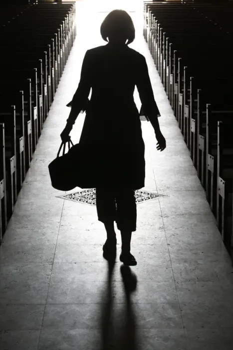Framed Print : Silhouette of a woman in church