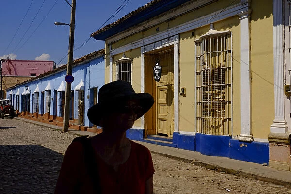 The silhouette of a woman on a quiet street, Trinidad, Sancti Spiritus, Cuba, West Indies