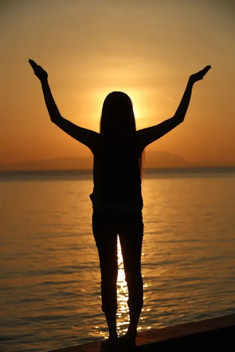 Framed Print : Silhouette of a woman standing by the sea at sunset doing yoga pose and meditation, Kep Framed Print : Silhouette of a woman standing by the sea at sunset doing yoga pose and meditation, Kep
