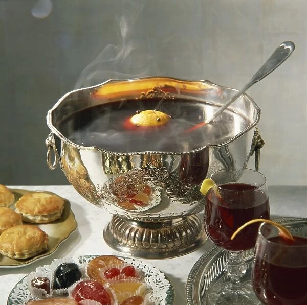 A silver bowl of mulled wine