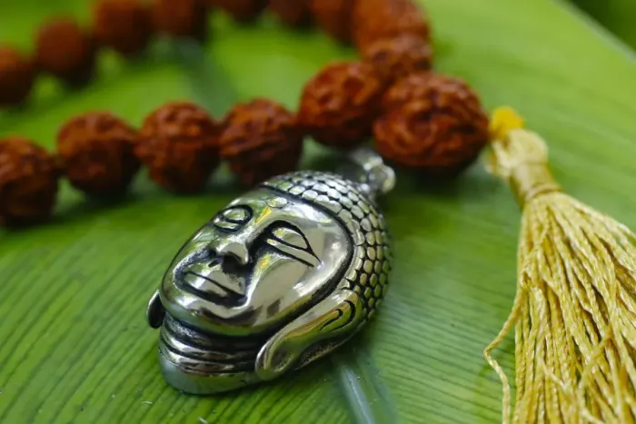 Framed Print : Silver Buddha medallion and prayer beads (mala) on a green leaf, Kep, Cambodia, Indochina Framed Print : Silver Buddha medallion and prayer beads (mala) on a green leaf, Kep, Cambodia, Indochina