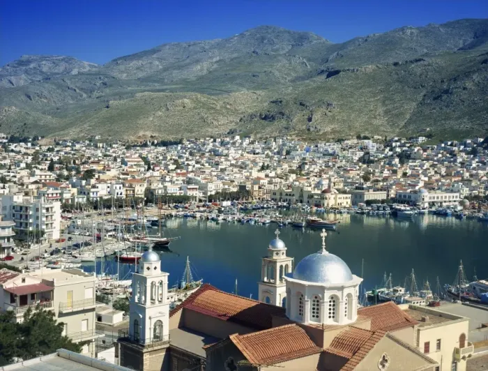 Framed Print : Silver domes of church with the port and town of Kalimnos behind, with hills in the background Framed Print : Silver domes of church with the port and town of Kalimnos behind, with hills in the background