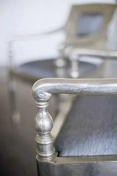 Detail of a silver leafed chair in the conference room
