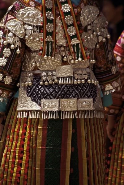 Detail of silver ornaments on festival dress of a Miao woman, Langde, Guizhou province