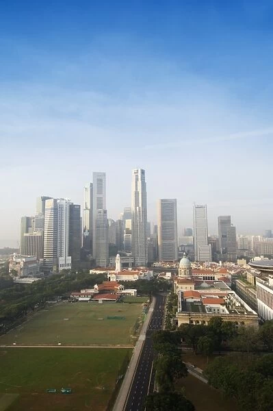 Singapore city skyline at dawn with the Padang and