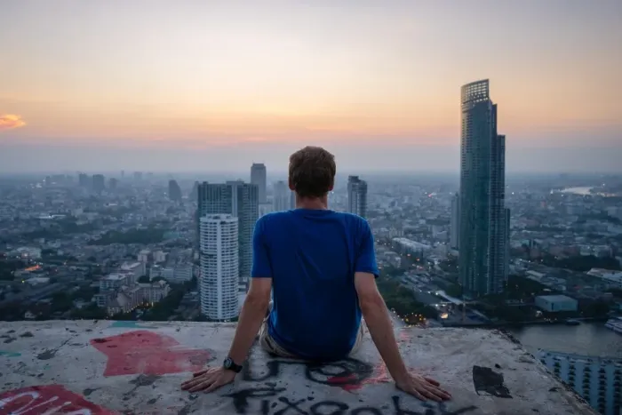 Framed Print : A single man watching sun set over city skyline at dusk, Bangkok, Thailand, Southeast Asia Framed Print : A single man watching sun set over city skyline at dusk, Bangkok, Thailand, Southeast Asia