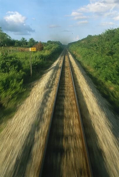 Single railway line seen from the train at speed