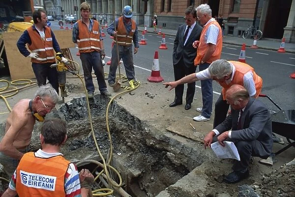 Site engineers consulting work in city centre