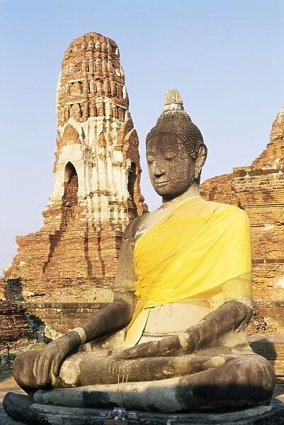 Sitting Buddha statue and chedi