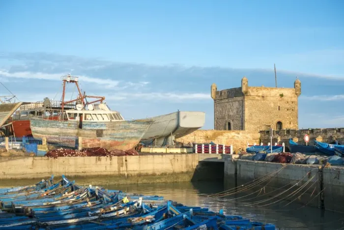 Framed Print : Skala du Port, 18th-century seafront ramparts and boats in the fishing port, Essaouira Framed Print : Skala du Port, 18th-century seafront ramparts and boats in the fishing port, Essaouira