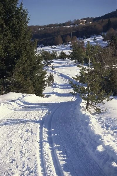 Ski traces in a snowy landscape near Vassillieux, in the National Park at Vercors