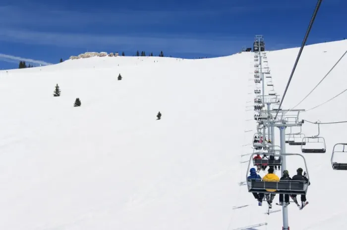 Framed Print : Skiers being carried on a chair lift to the back bowls Framed Print : Skiers being carried on a chair lift to the back bowls